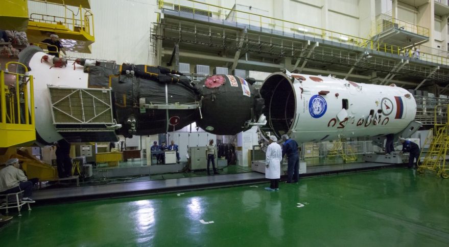 The Soyuz MS-02 spacecraft being prepared for launch in September. A problem with the spacecraft found only after it was placed inside its payload fairing has delayed its launch until the end of October. Credit: NASA/Victor Zelentsov