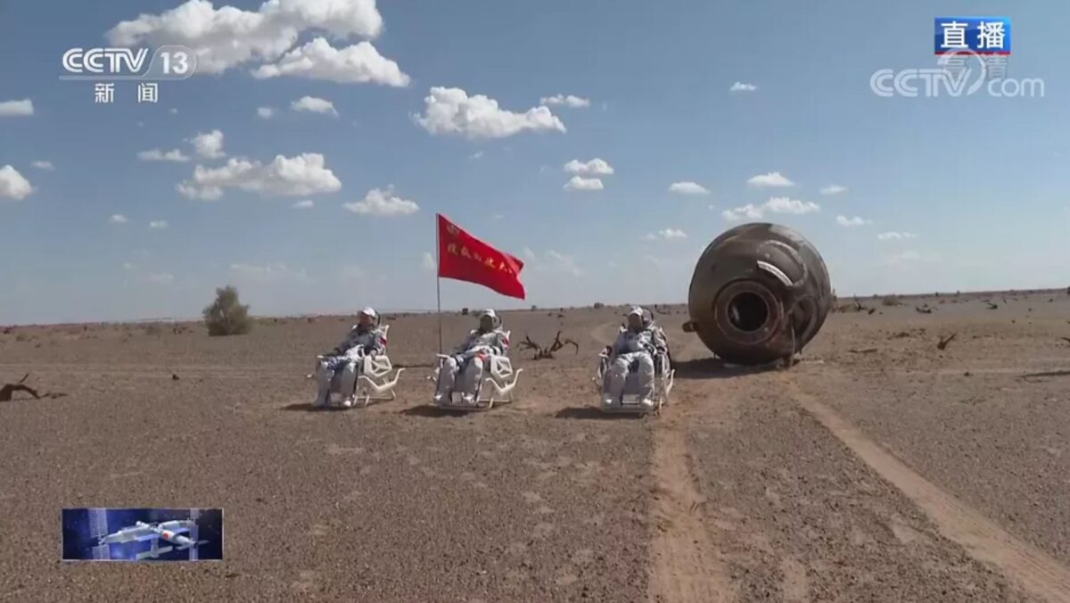 The three Shenzhou-12 astronauts outside of the return module after landing in Dongfeng, Sept. 17, 2021.