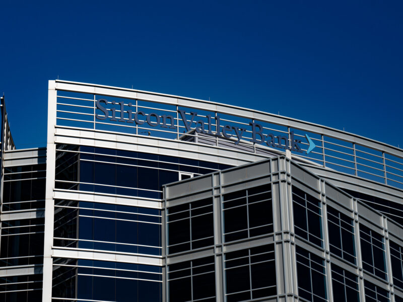 A 2020 photo of the Silicon Valley Bank offices in Tempe, Arizona. The upper corner of the office building is framed against a deep blue sky.
