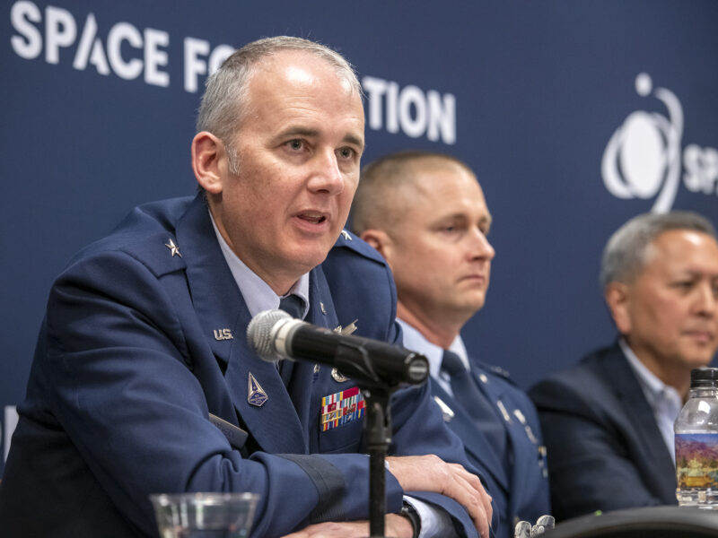 From left to right: Space Systems Command officials Brig Gen. Jason Cothern, Col. Brian Denaro and Cordell DeLaPena speak with reporters Apr 18, 2023 at the Space Symposium. Credit: Tom Kimmell